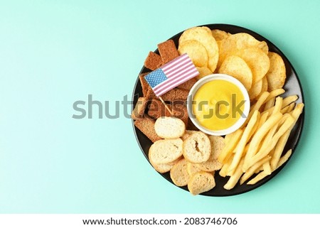 Concept of Super bowl snacks on mint background