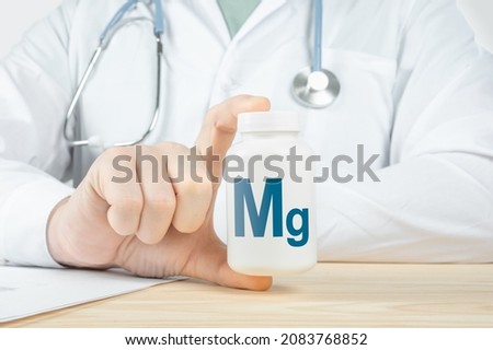 Magnesium Mg supplements for human health. Doctor recommends taking magnesium Mg. doctor talks about Benefits of magnesium. Essential vitamins and minerals for humans. Mg Health Concept. Royalty-Free Stock Photo #2083768852