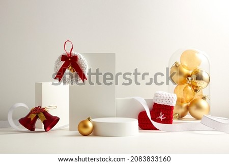 White podium with white background and christmas ornament decoration , front view , for product advertising , holiday content