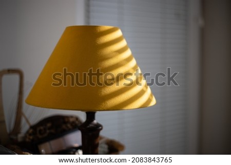 Light strips on
yellow lampshade.