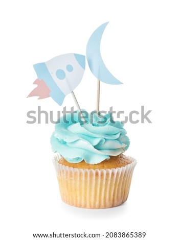 Tasty cupcake with stylish toppers on white background