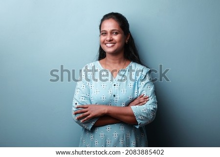 Portrait of a smiling woman of Indian ethnicity 