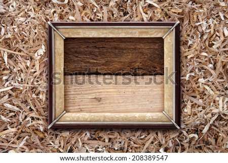 Old frame on a wooden background