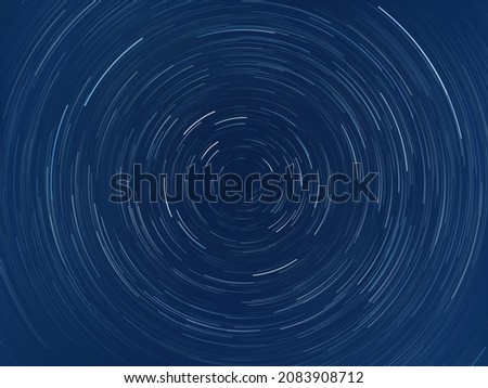 Photographs of the sky taken with long exposures. The result is an image with stars trailing across the sky in concentric streaks, often whirling around.