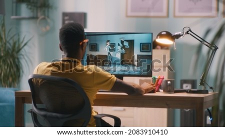Man creating 3D cartoon on computer Royalty-Free Stock Photo #2083910410