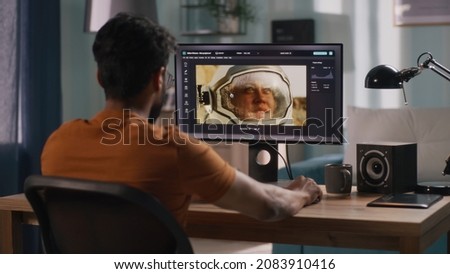 Anonymous man editing cosmonaut picture