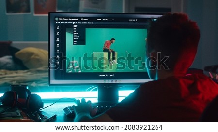 Teenager using 3D software on computer