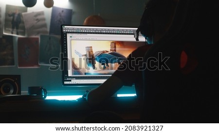 Teenager creating 3D cartoon on computer Royalty-Free Stock Photo #2083921327