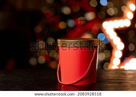 Red christmas gift box on bokeh background. High quality photo