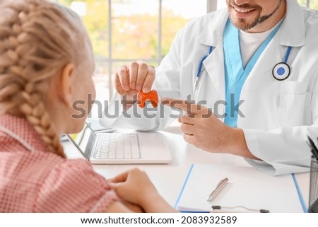 Little girl visiting endocrinologist in clinic
