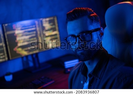 Photo of confident successful operator look camera working midnight business center dark room space
