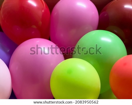 Take close-up shots of colorful balloons
