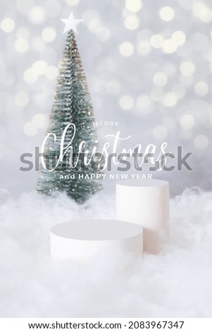 PMerry Christmas greetings and podium or pedestal in the snow with a christmas tree on a bokeh background vertical format