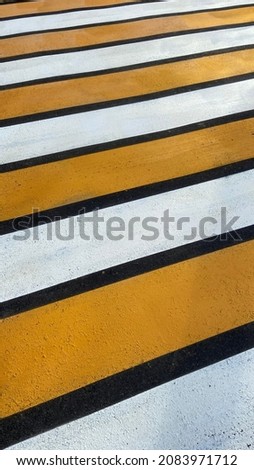 new road markings in yellow and white paint