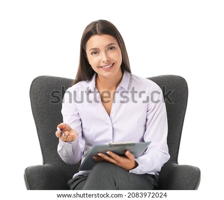 Portrait of female psychologist sitting in armchair on white background Royalty-Free Stock Photo #2083972024