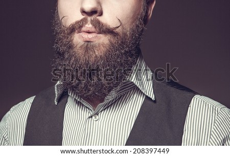Close Up of long beard and mustache man Royalty-Free Stock Photo #208397449