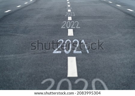 Empty asphalt road with number 2020, 2021, 2022.