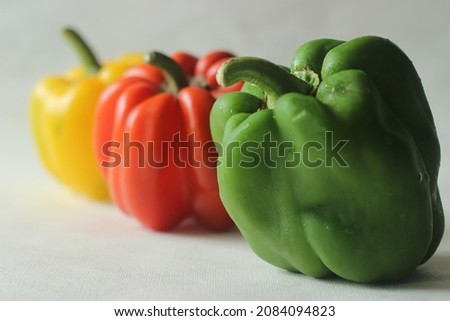 Red yellow and green bell peppers. Bell pepper or Capsicum annuum, also called sweet pepper or capsicum. Bell peppers are used in salads and in cooked dishes and are high in vitamin A and vitamin C Royalty-Free Stock Photo #2084094823