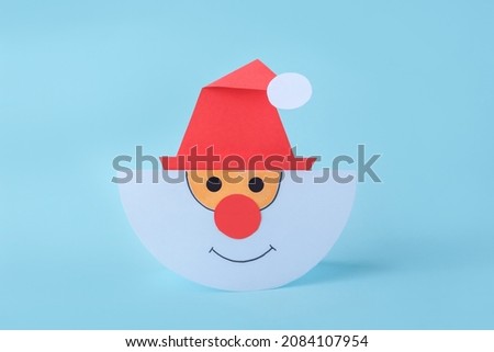 DIY and kid's creativity. Step by step instruction: how to make Santa claus from paper. Step5 finished work Santa. Children's Christmas and New year craft
