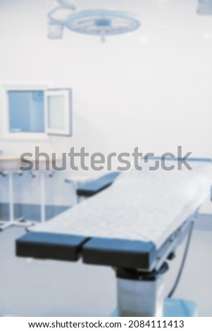 Abstract blur of hospital and clinic interior. Modern equipment in operating room. Medical devices for neurosurgery. Surgery instruments and surgical procedures. Background with blue filter.