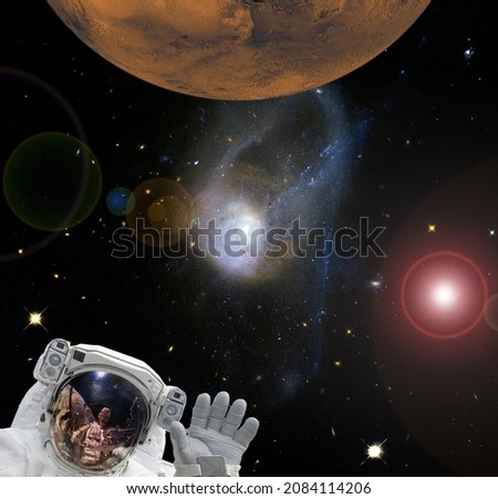 Astronaut and Mars. Deeps space. The elements of this image furnished by NASA.

