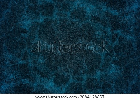 Dark blue grunge texture background of embossed surface