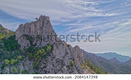 Aerial photography rock formation of sandstone mountains of great height with Mediterranean vegetation with intense blue sky Geological formation of great interest Granada Andalusia Spain