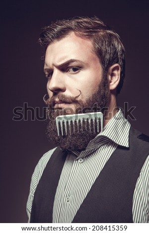 Portrait of a man with a long beard Royalty-Free Stock Photo #208415359