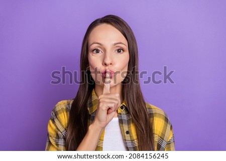 Photo of cute mature lady finger mouth wear plaid shirt isolated on purple color background