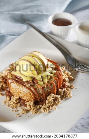 Dessert saffron cake with caramel in white plate