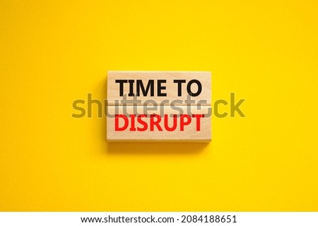 Time to disrupt symbol. Concept words Time to disrupt on wooden blocks on a beautiful yellow background. Business and time to disrupt concept. Copy space. Royalty-Free Stock Photo #2084188651