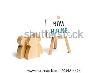 People group with a Now Hiring sign. Hire staff. Employment agency. Staffing. Search and recruitment of new employees for work. Human resources. Team building, teamwork cooperation.