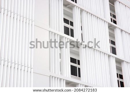 white building side view with windows and balcony Royalty-Free Stock Photo #2084272183