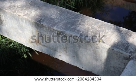picture of a large cement stone that stands firm