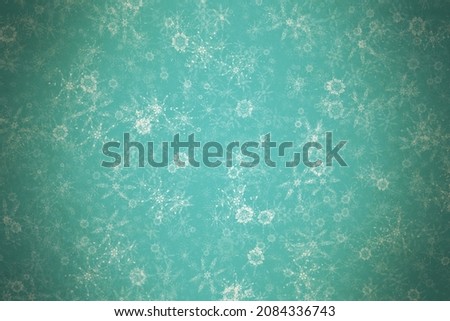 christmas vintage background with snowflakes on old paper texture