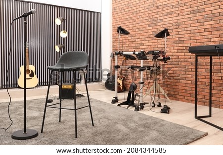 Modern music studio interior with different electronic instruments Royalty-Free Stock Photo #2084344585