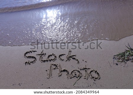 Stock photo sign on the beach sand