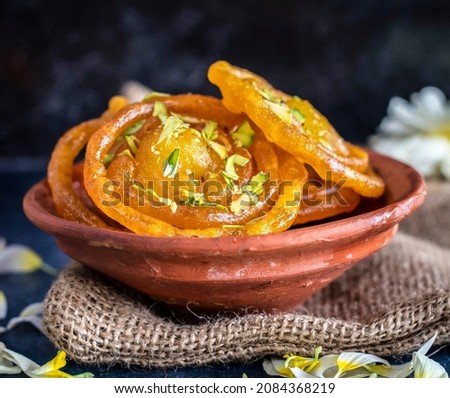 Indian Sweet Jalebi or imarti. Jalebi is one of the most delicious sweets widely used in India. Selective Focus, Selective Focus on Subject, Background Blur. Royalty-Free Stock Photo #2084368219
