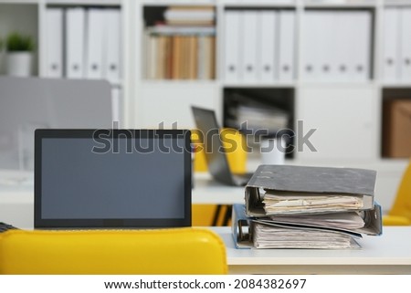 Empty workplace of an office worker, blurry