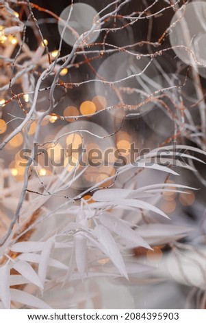 Winter holiday, illumination and decoration concept - bokeh of Christmas garland lights