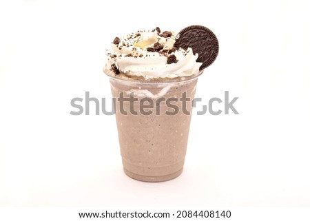 Cookies and cream frappe with whipped cream and biscuits.  Royalty-Free Stock Photo #2084408140