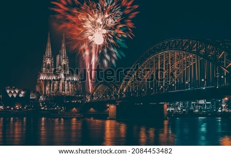 Holiday background -  Cologne Cathedral with fireworks, celebration of the New Year in Cologne, Germany