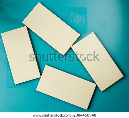 Green ceramic files on the blue background, geometric figure squares