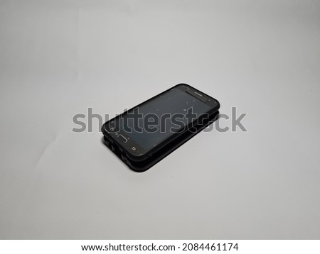 Black mobile phone on white background