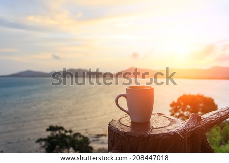 Coffee cup and sunset Royalty-Free Stock Photo #208447018