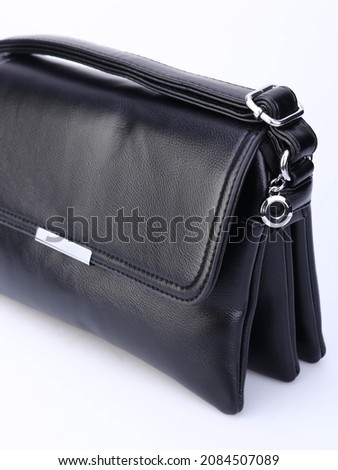 black leather bags on a white background and on the model