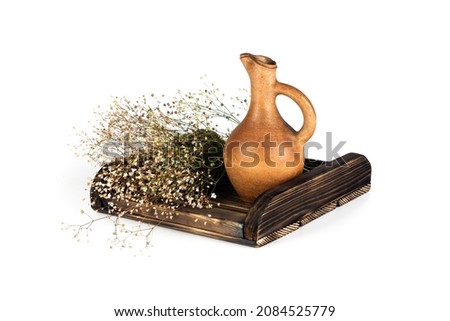 wooden tray with Georgian traditional decorative   query and dry flowers. Royalty-Free Stock Photo #2084525779