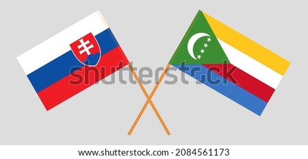 Crossed flags of Slovakia and the Comoros. Official colors. Correct proportion. Vector illustration
