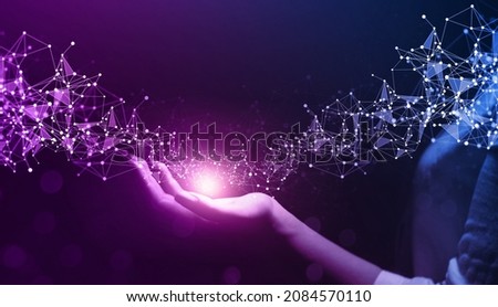 Metaverse Technology. Internet communication and wireless connection technology.Hand holding global network connection. Futuristic technology with polygonal shapes.