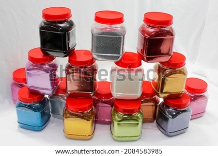 colourful glitter powder bottles used for glitter printing Royalty-Free Stock Photo #2084583985